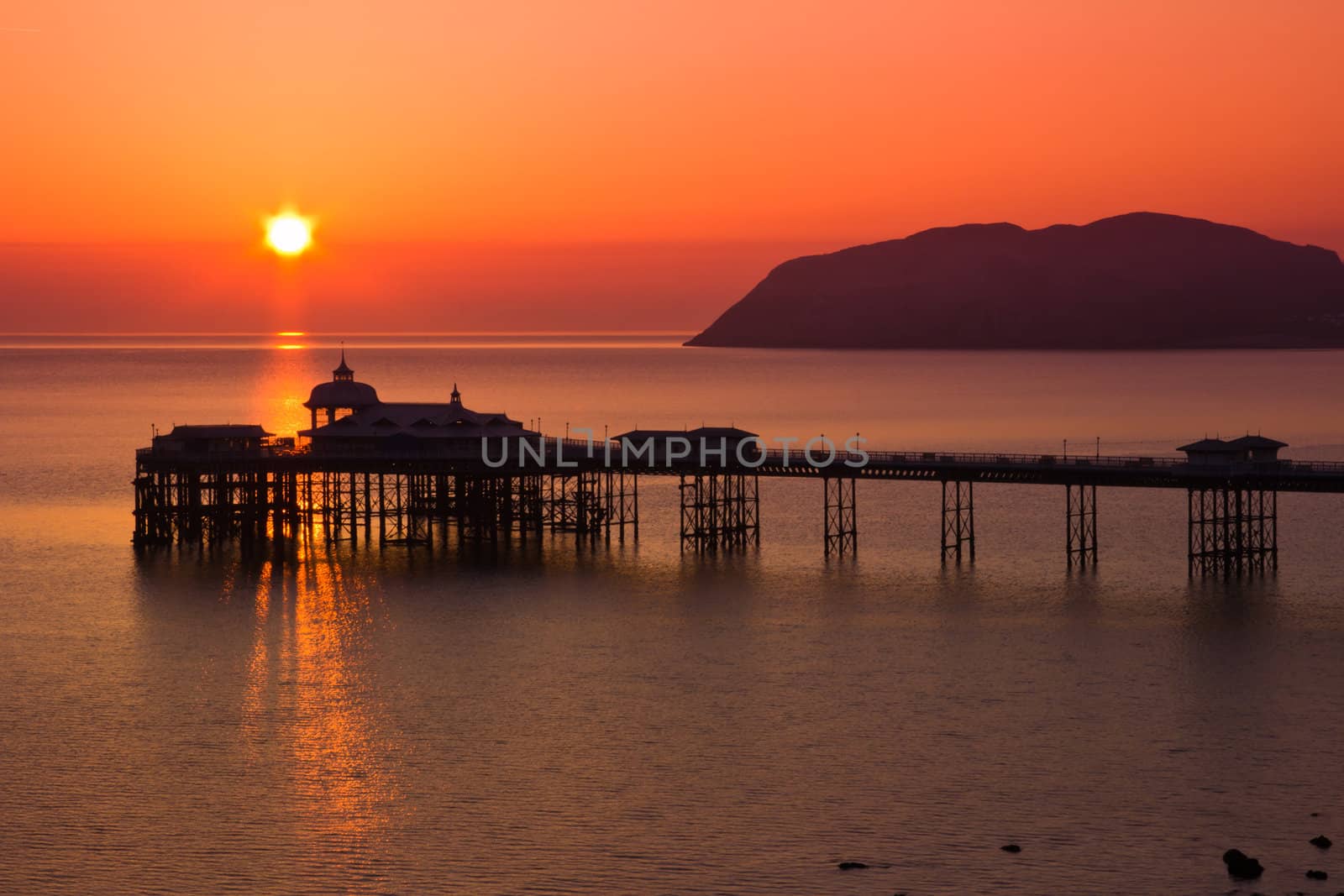 A Beautiful Sunrise over the pier in Llanudno Wales