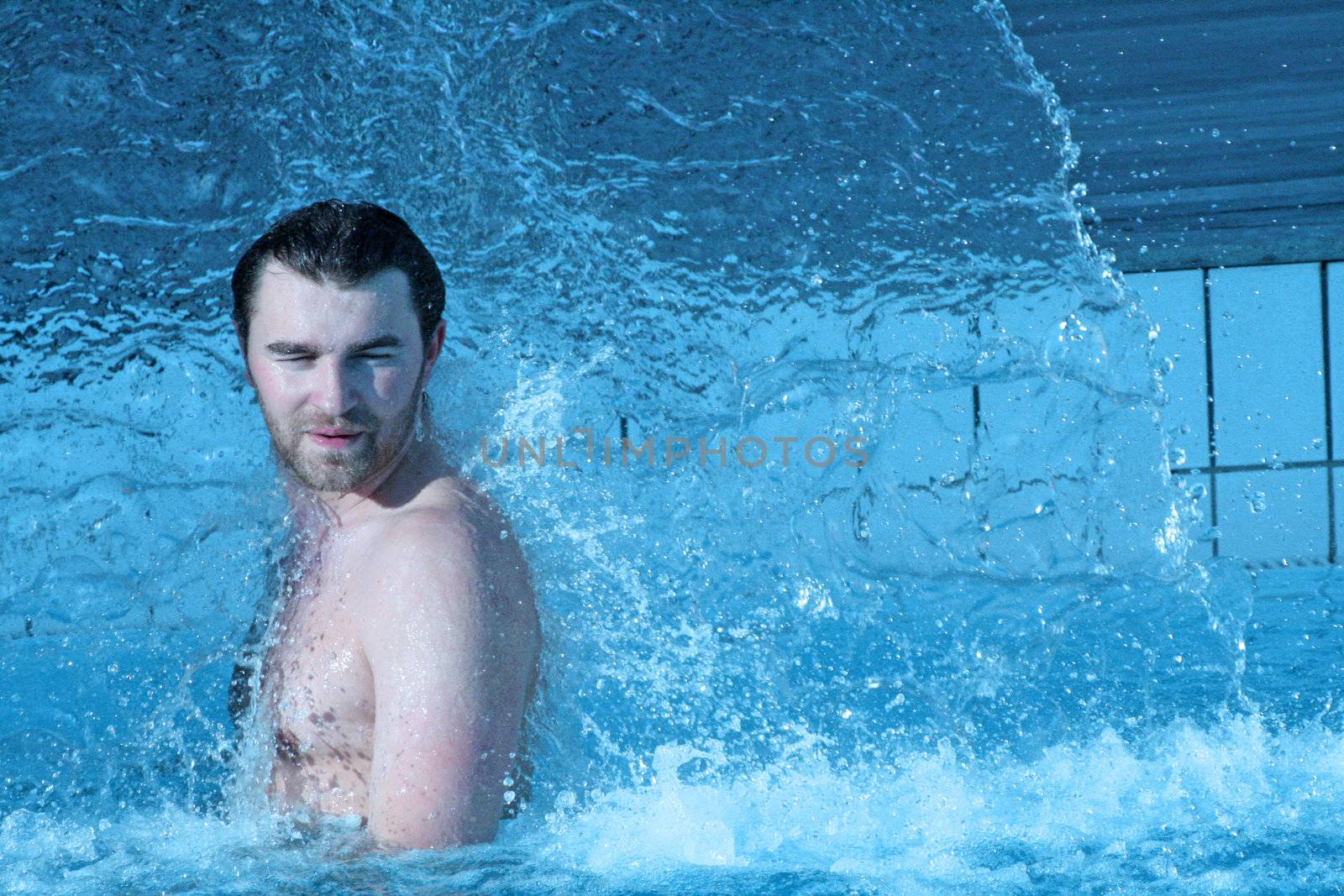 young attractive man relax in spa area