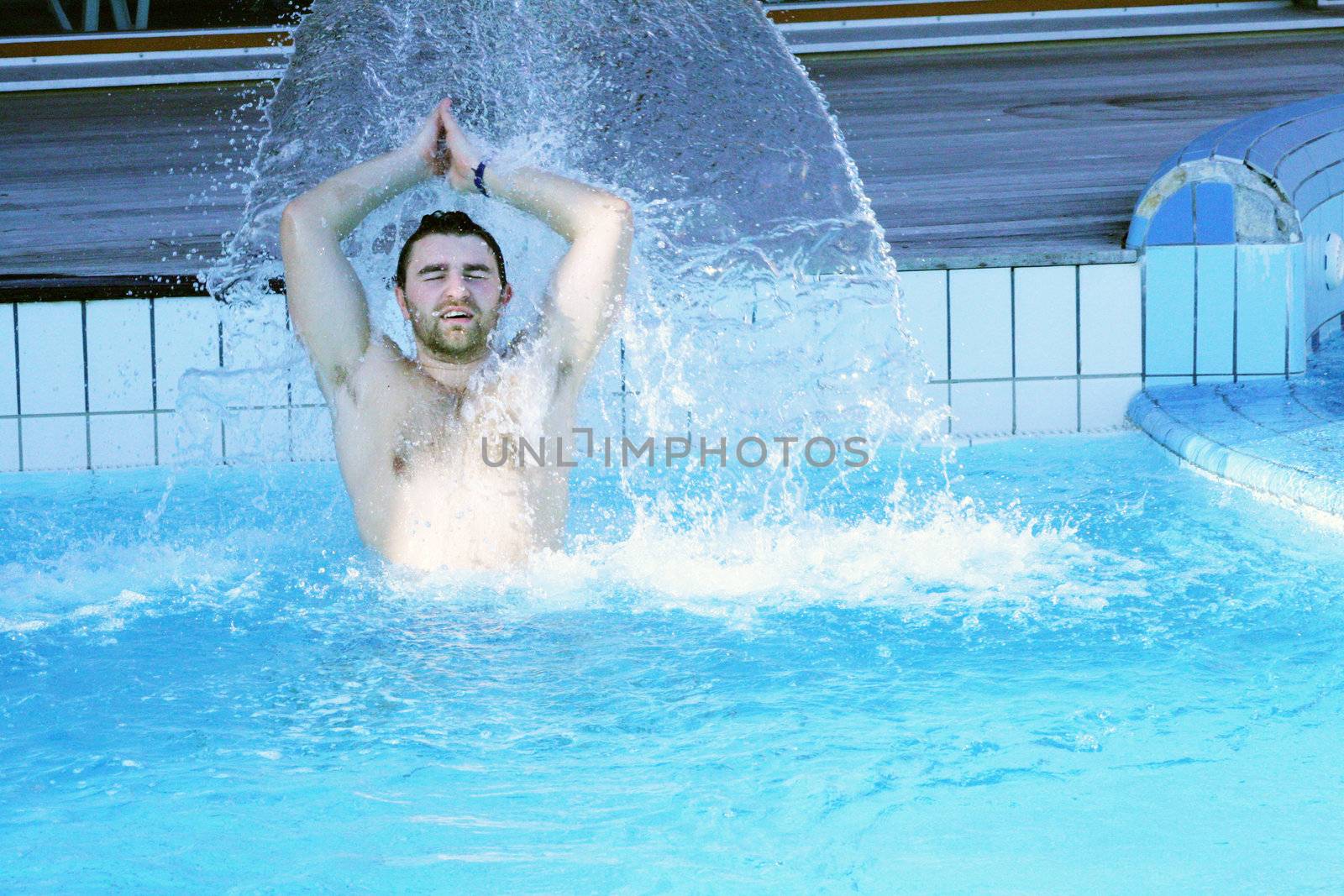 young attractive man relax in spa area