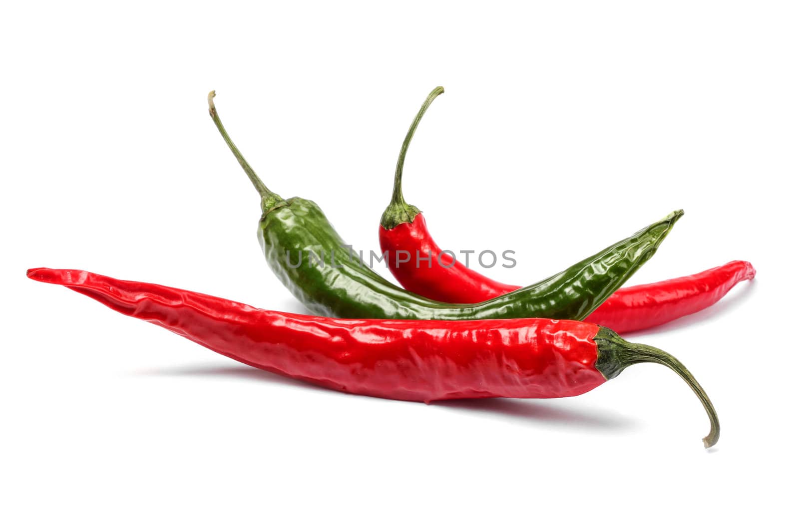 Red and green chili peppers isolated on white