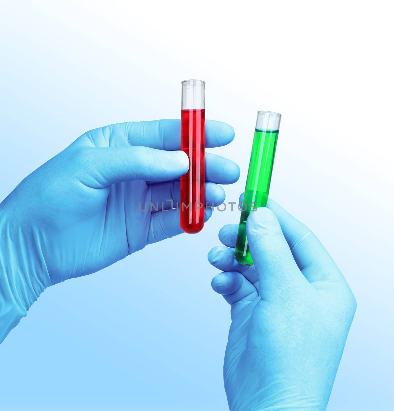 Chemist hands in proctective gloves holding sample liquids in test tubes