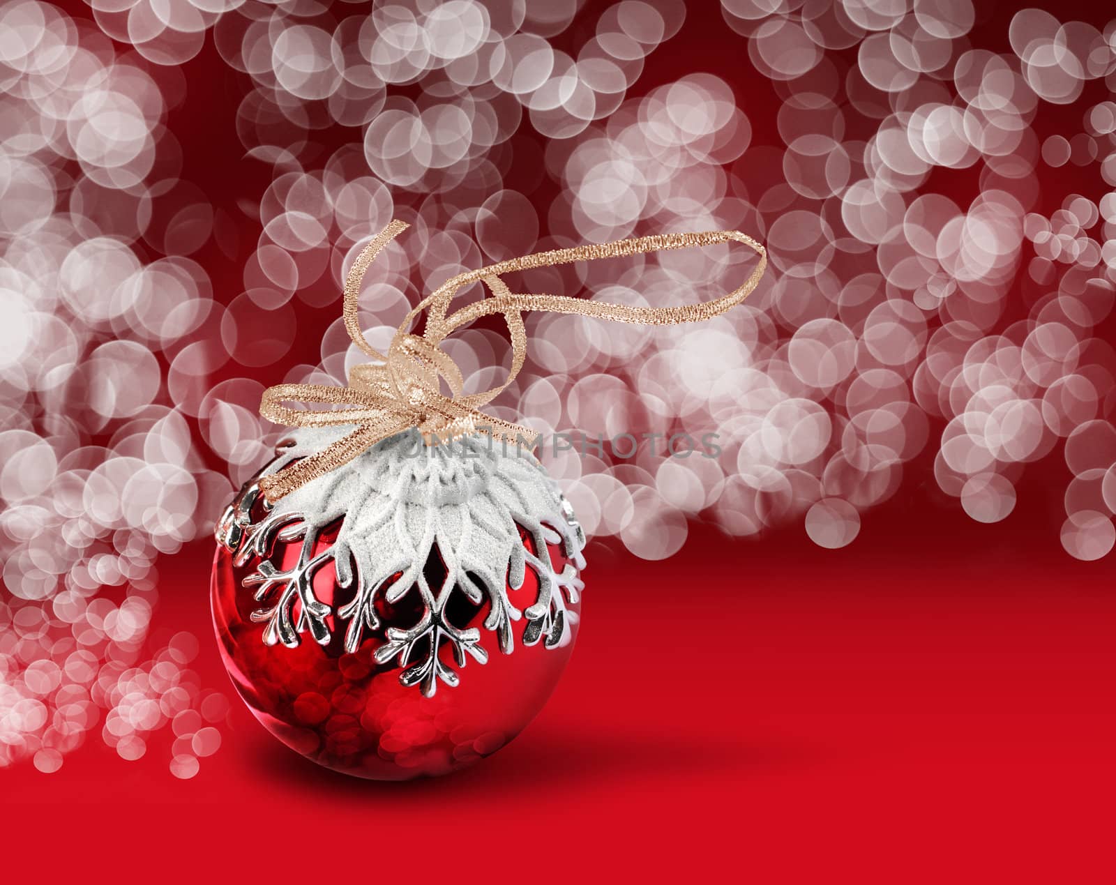 Christmas ball red bokeh background by anterovium