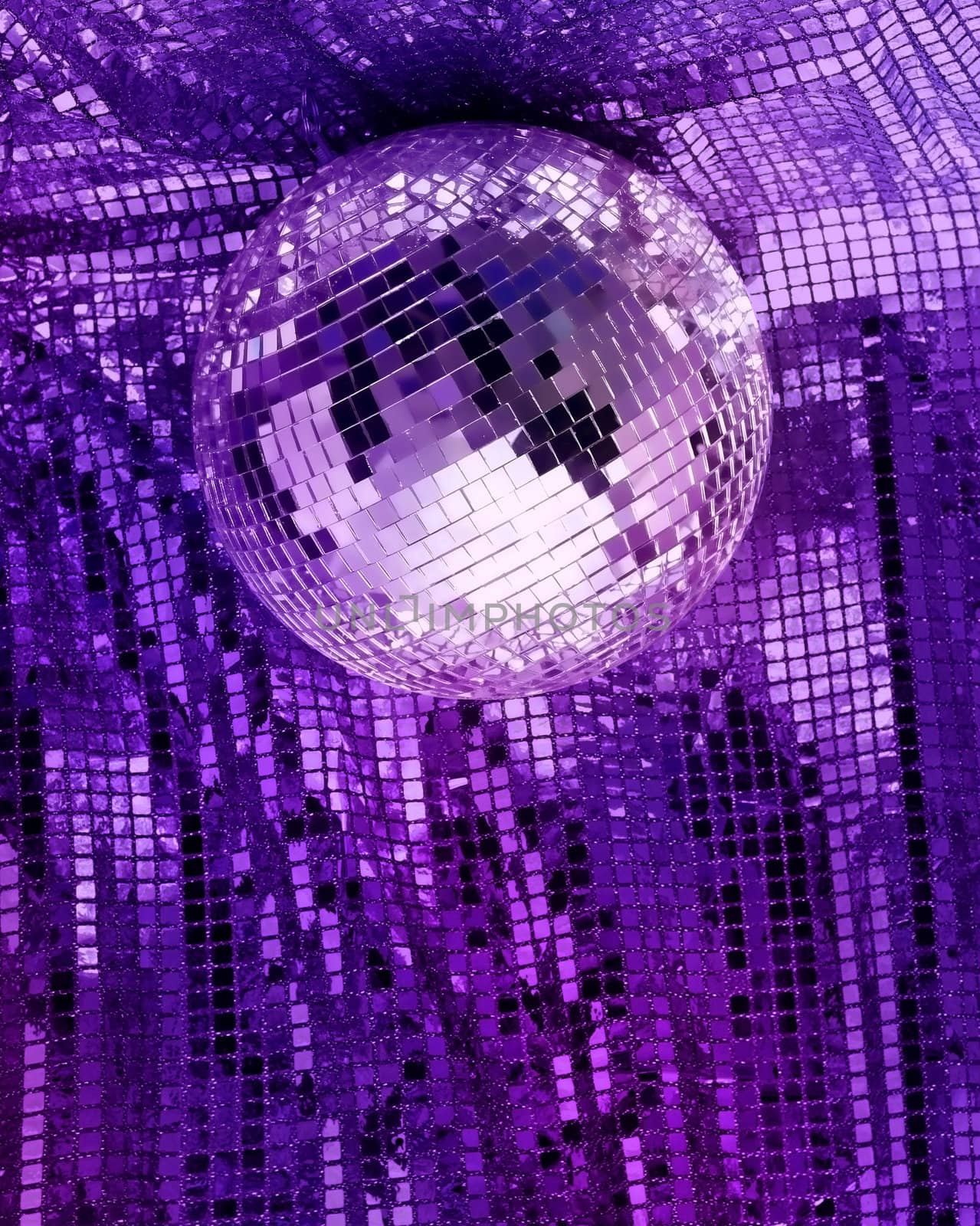 Purple disco mirror ball reflect light on glitter canvas background