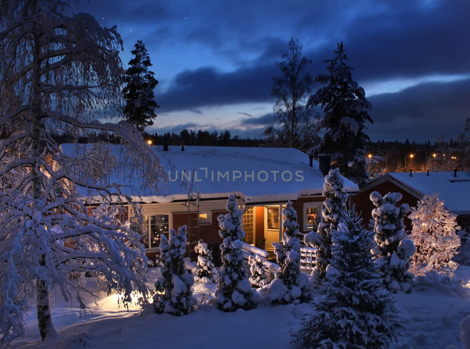 Snowy house on Christmas evening by anterovium