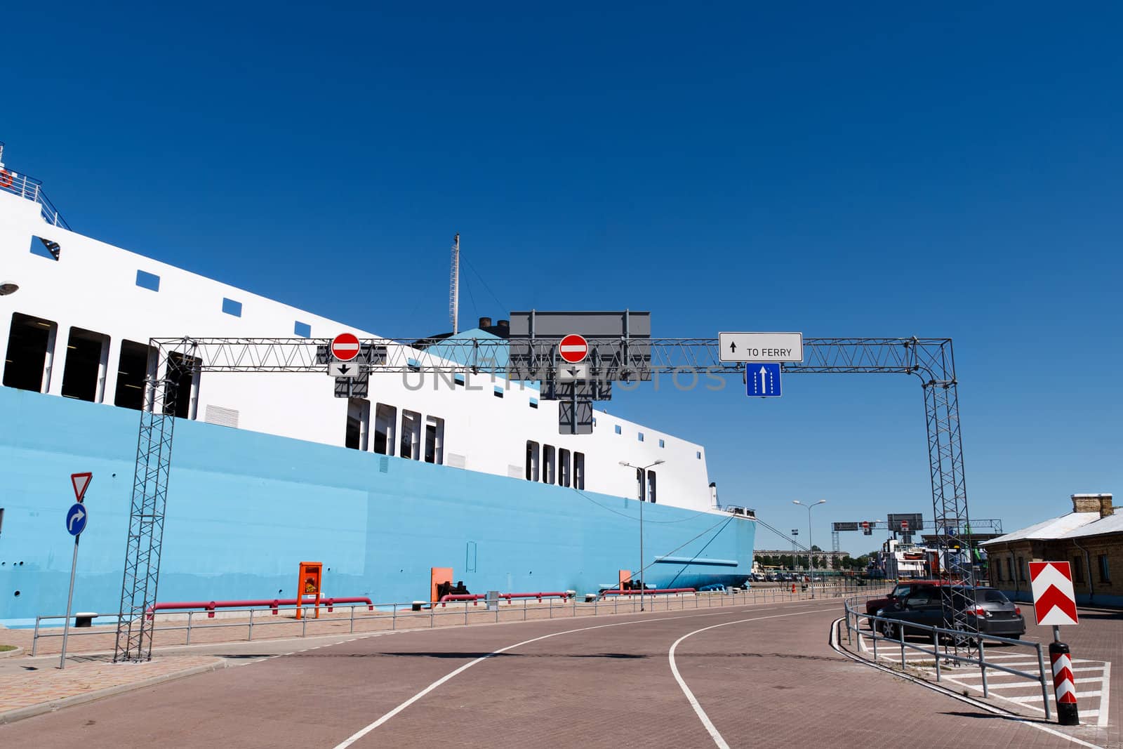entry to the ferry port with a ferry in the background