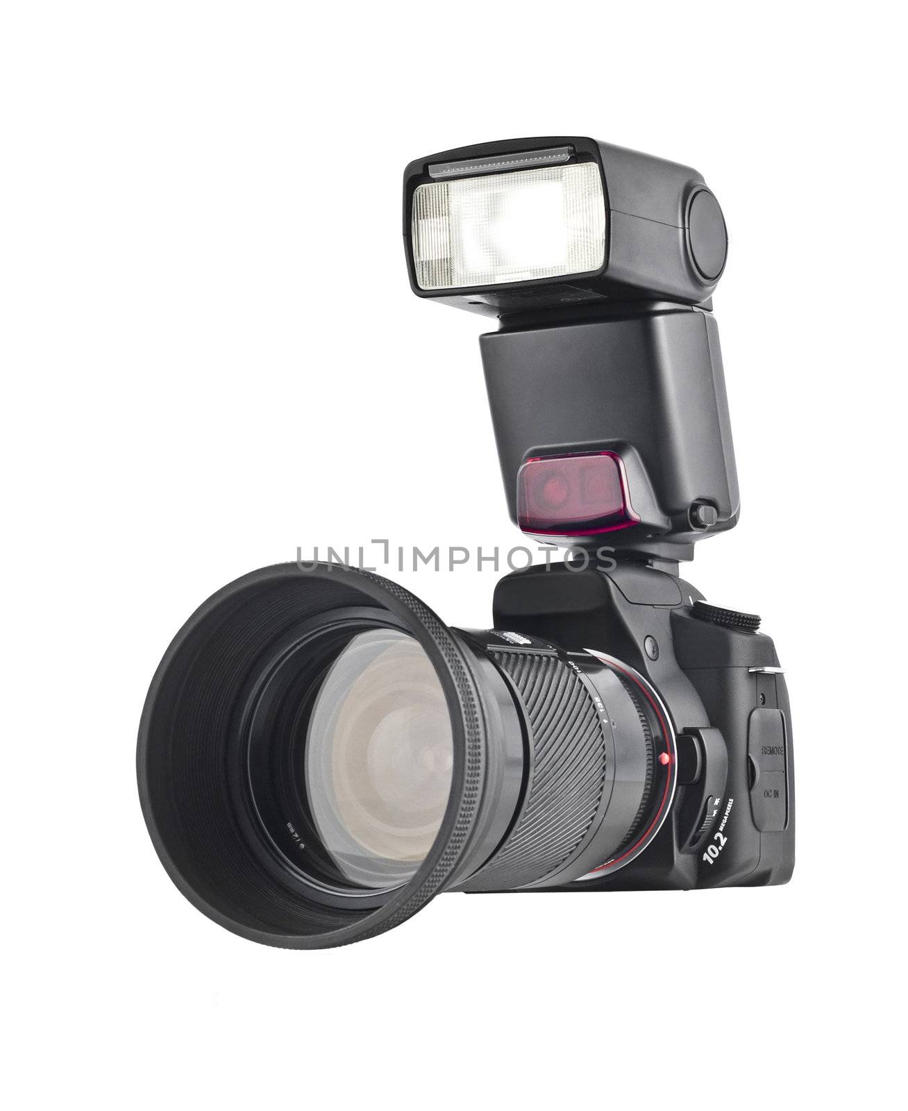 Professional camera with telephoto lens and flash isolated over white