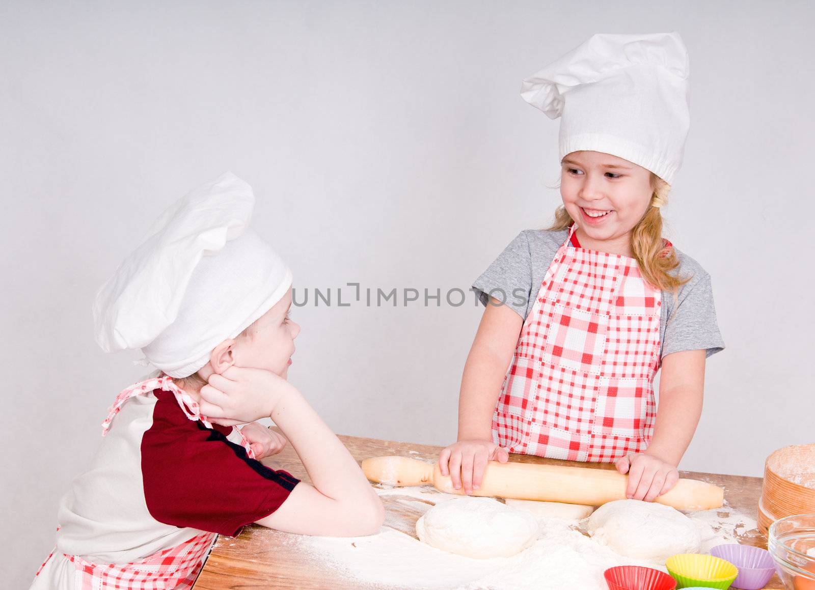 girl and boy  in chef's hats by uriy2007