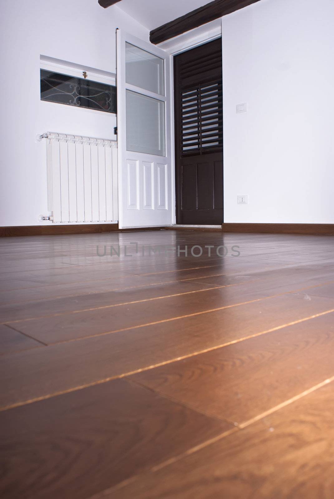 room with hardwood floors by gandolfocannatella