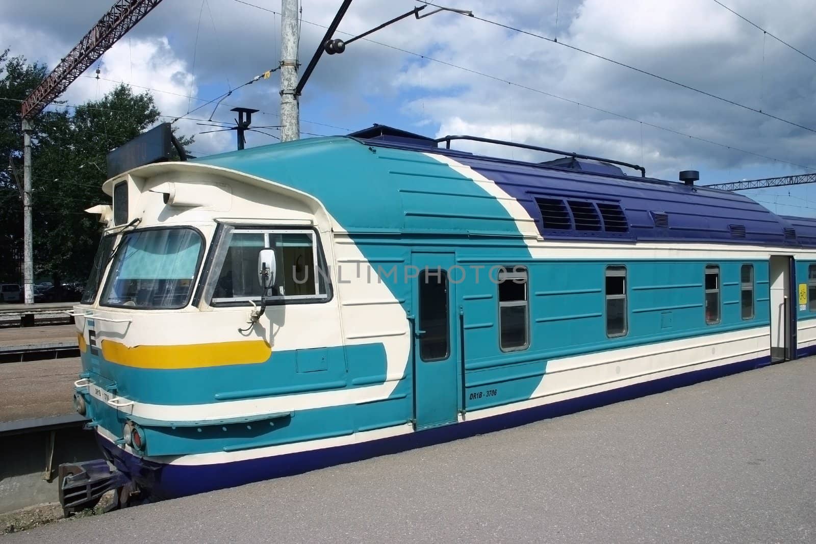 Electric train, the passenger locomotive at station by AlexandrePavlov