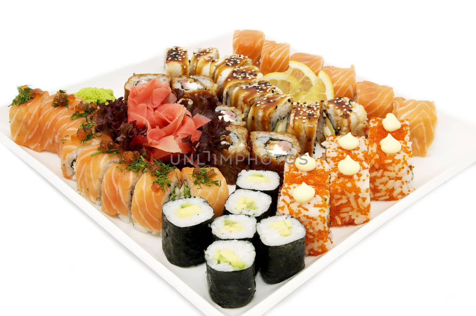 large assortment of sushi on a white plate