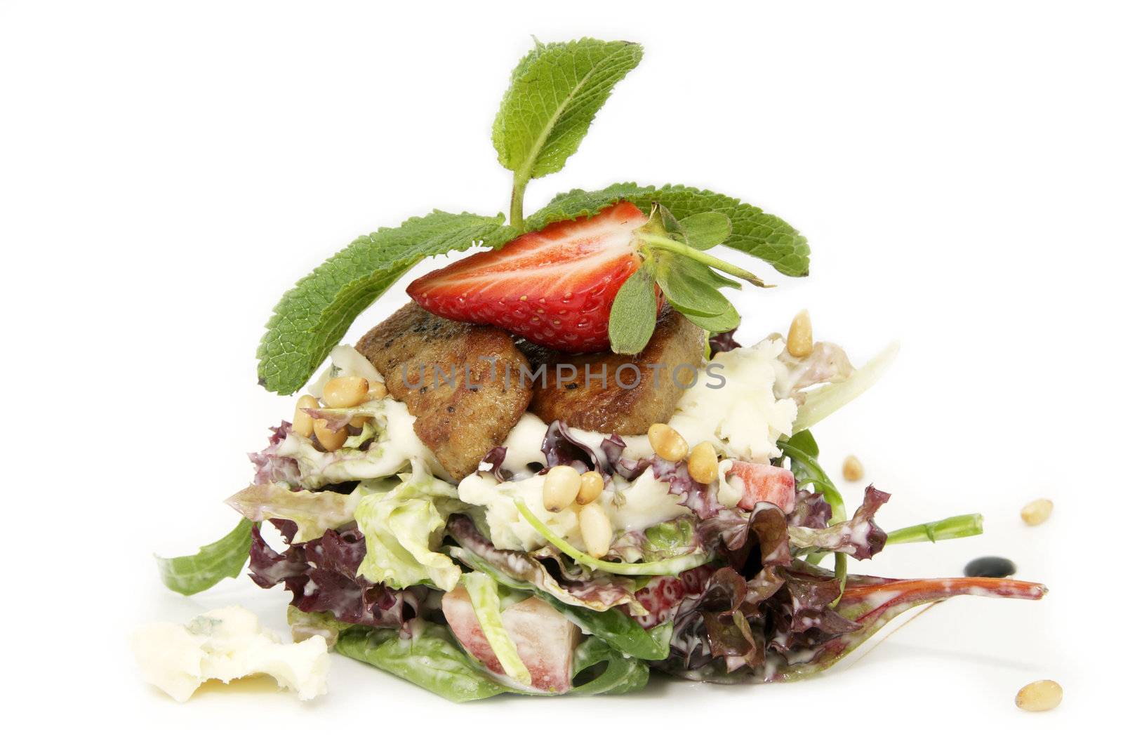 a salad of vegetables and meat on a white background