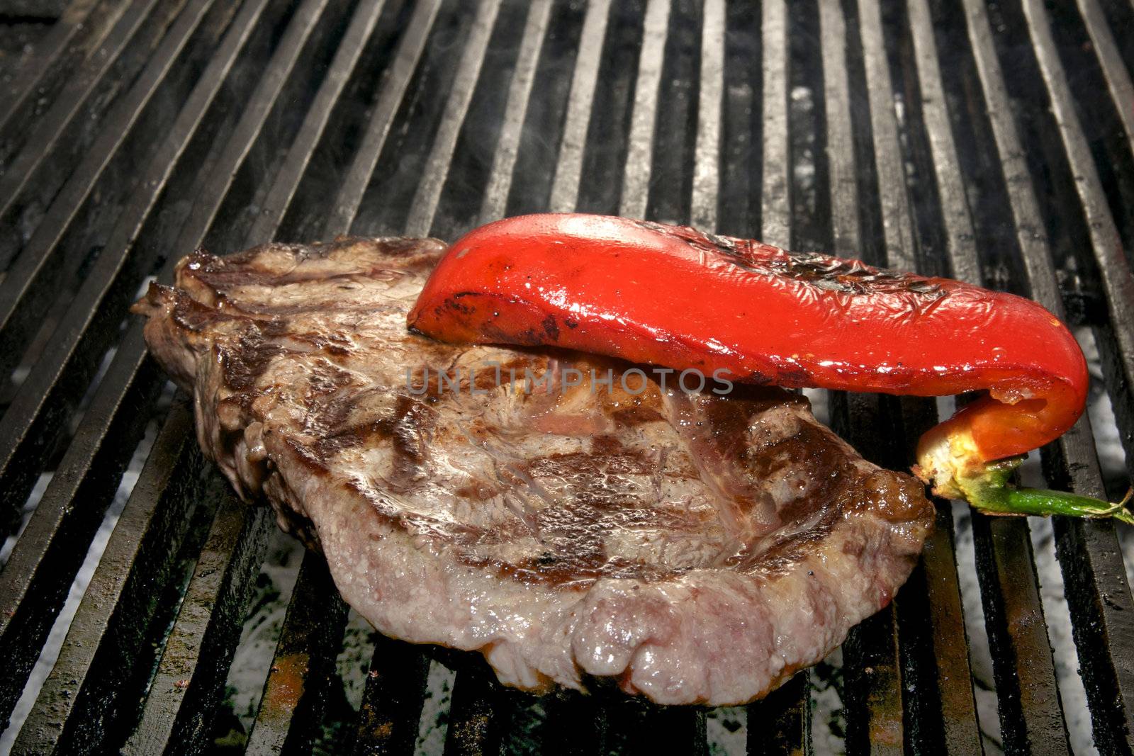 large watering steak cooked on the grill