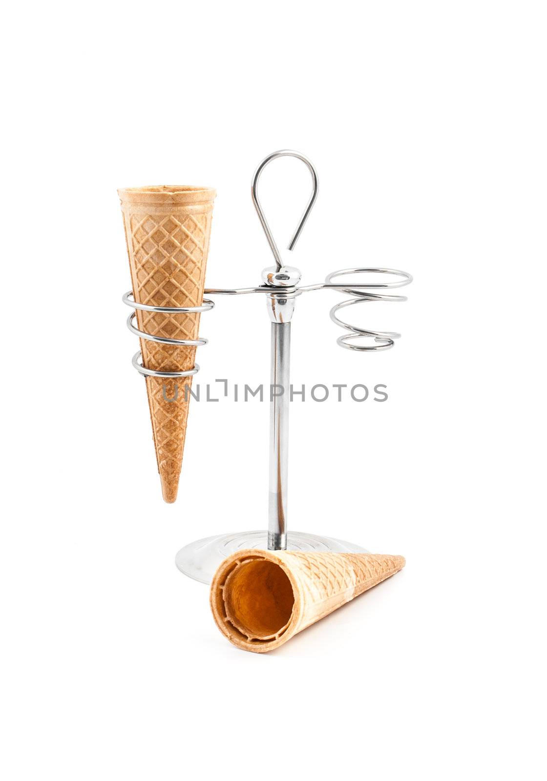 Empty wafer cone on white background with a support