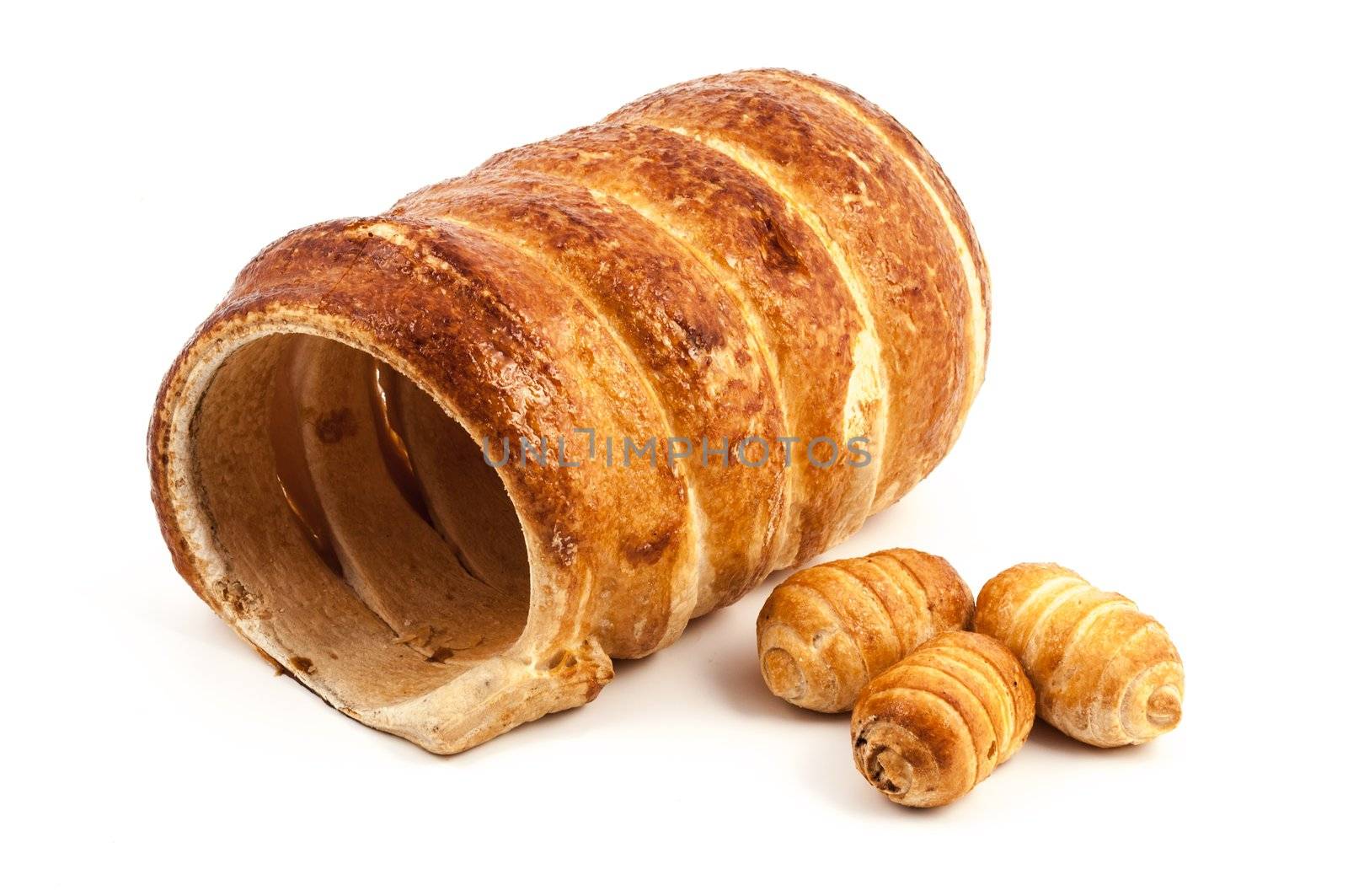 Three empty typical italian cannoli pastry and a big one on white background