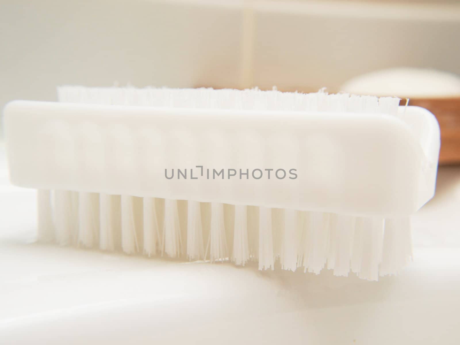 White nail brush, in bathroom, on sink, hygienic