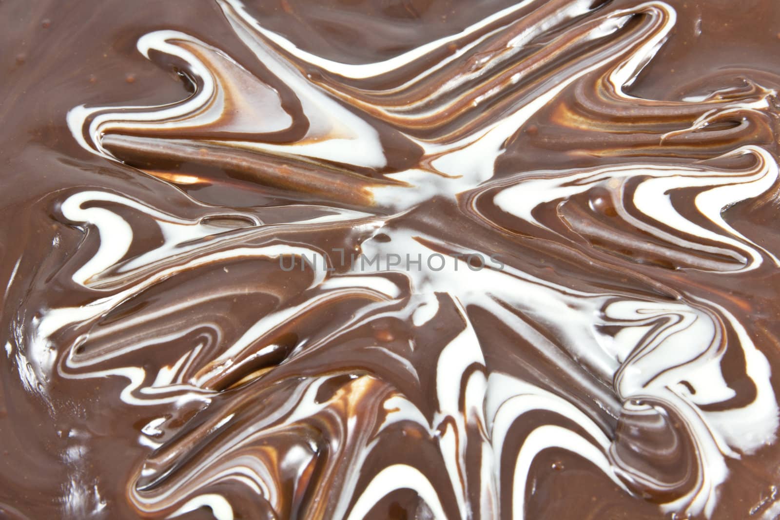 Picture of white and black chocolate mixed together forming a texture