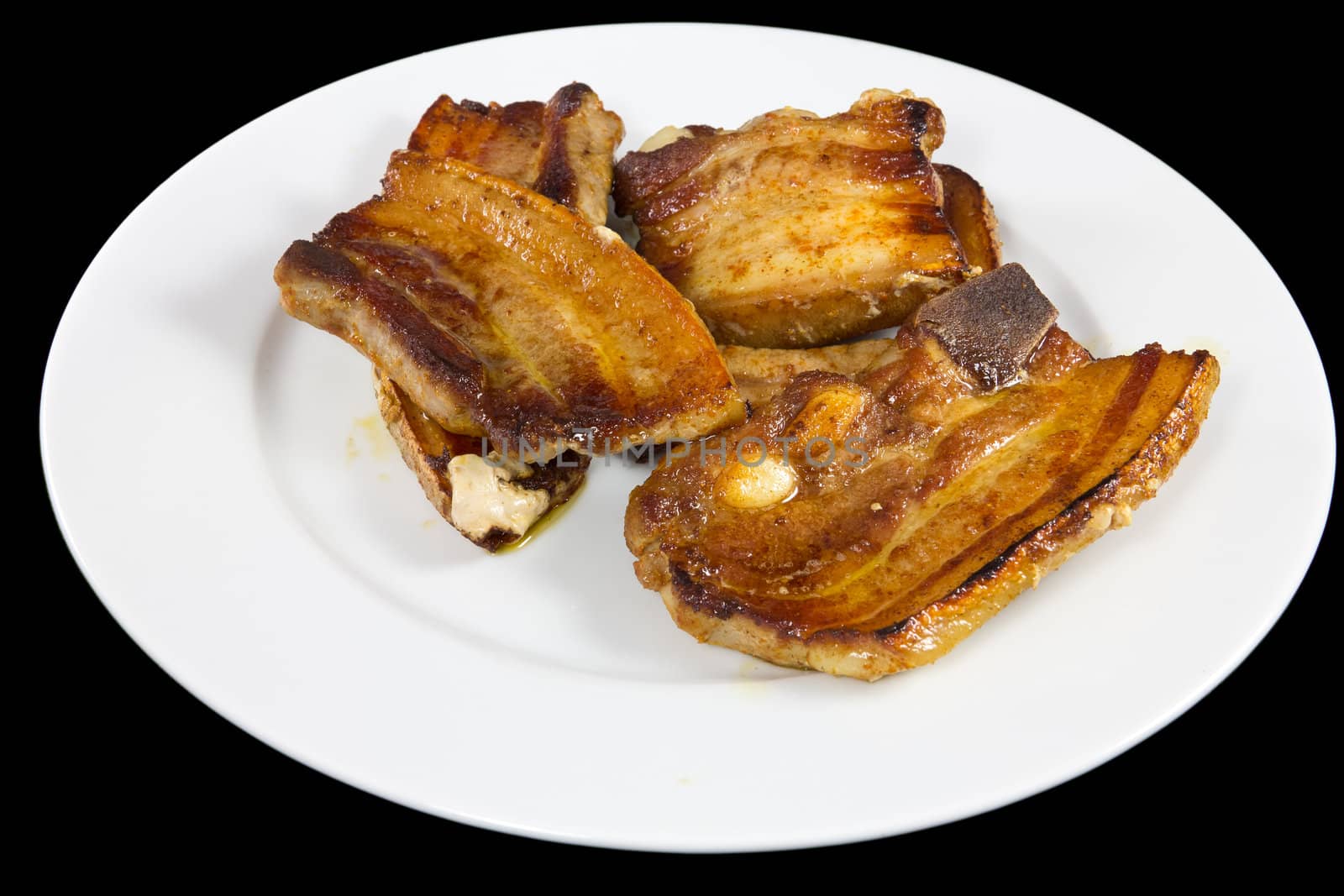 Picture of some slices of pork cooked and ready to serve