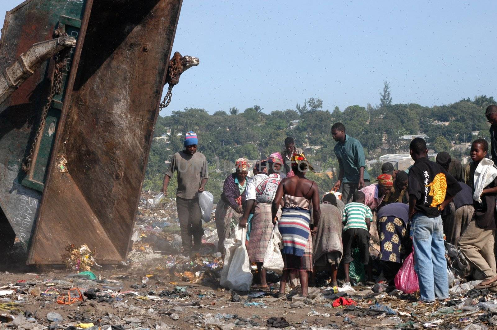 Maputo, Mozambique - May 14, 2004
 African poor in the dump of the capital of Maputo in Mozambique. There are many street people in the garbage looking for food, bottles, iron Latin resell