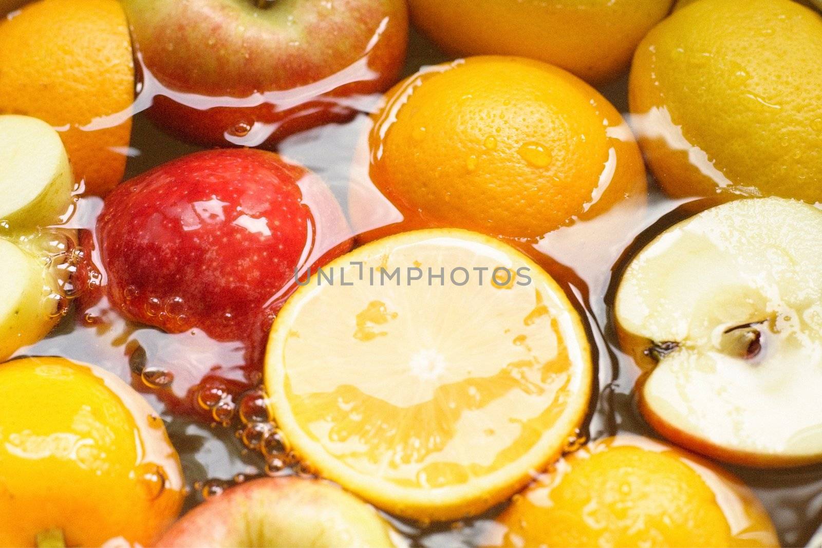 fresh fruit, apples, lemons, oranges, - swim in juice, water..