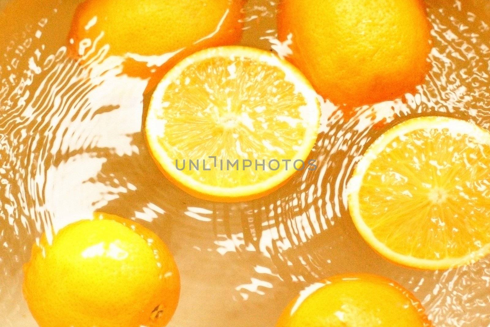 fresh fruit oranges, - swim in juice, water..