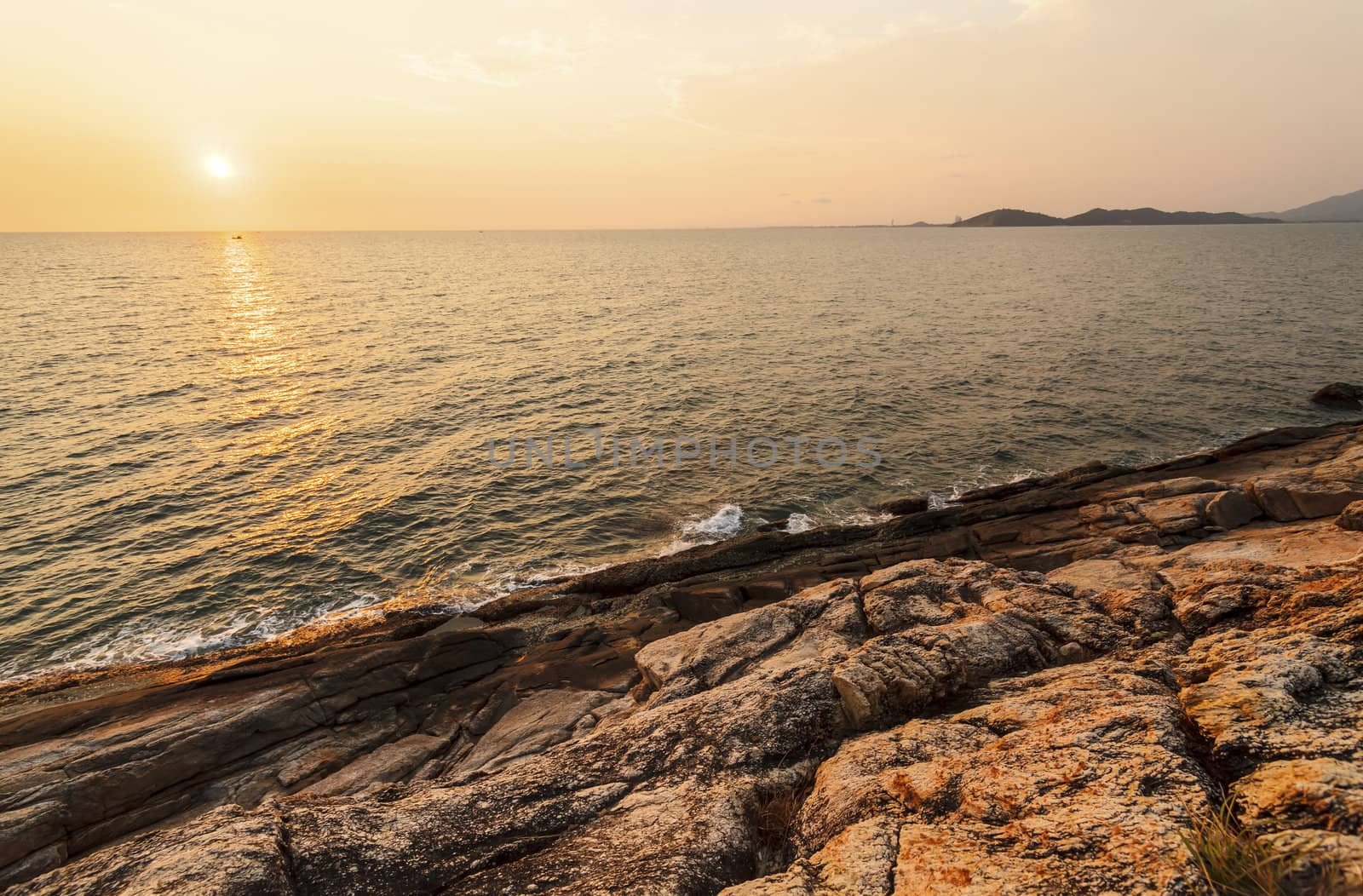 Before beatiful sunrise on the rocks, Rayong, Thailand. by jame_j@homail.com