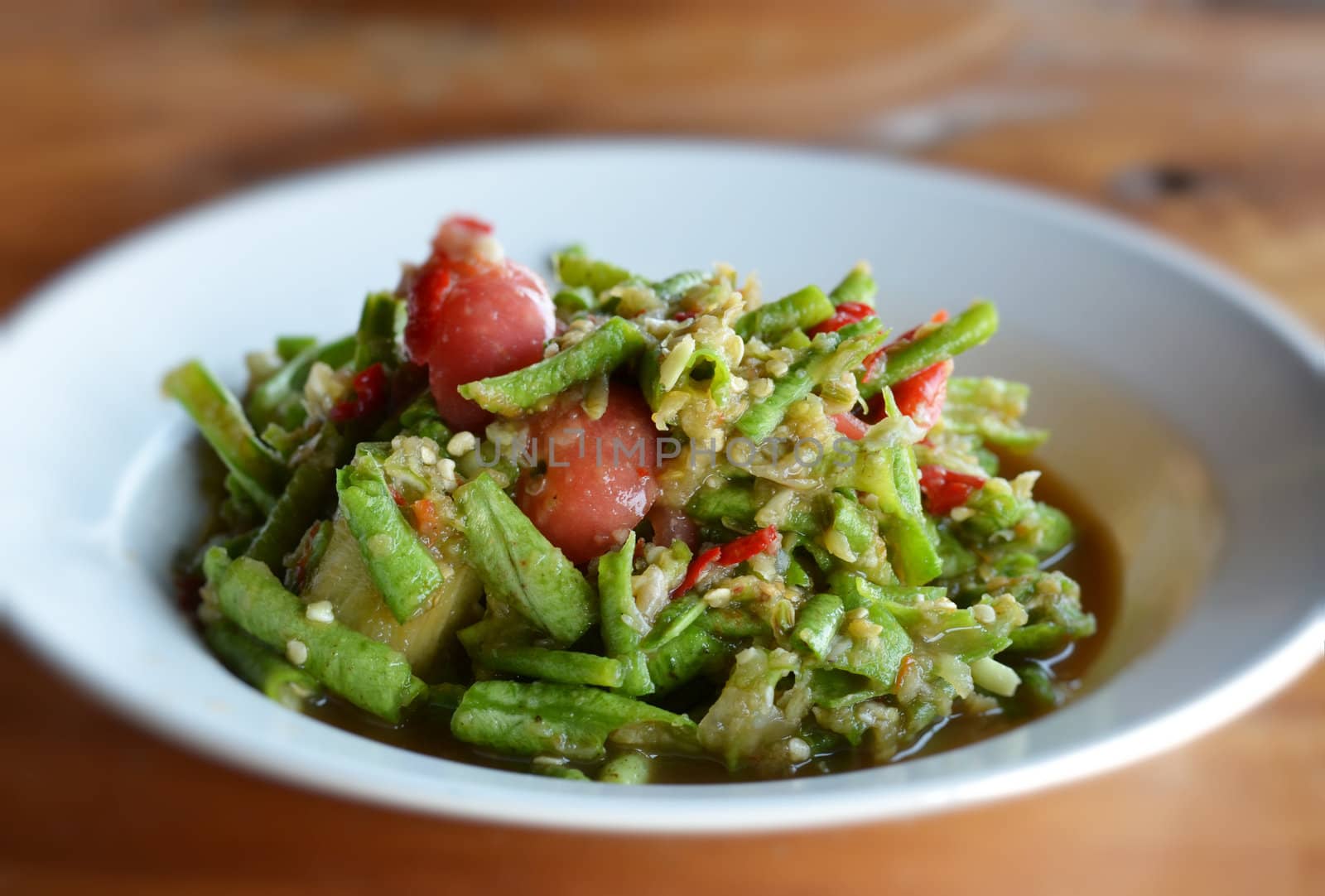 String bean spicy salad on white  dish