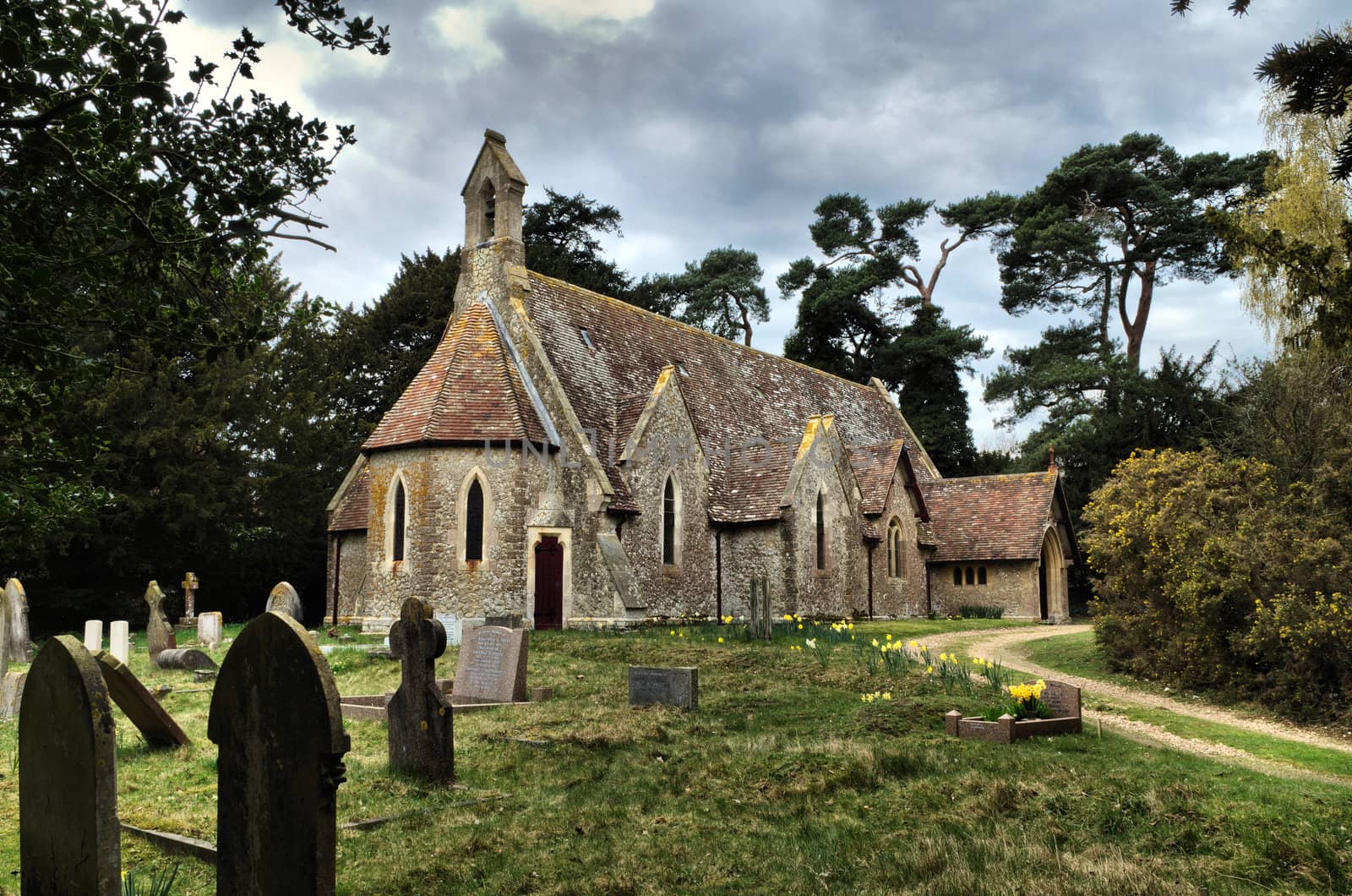 Holy Trinity Church, Charing Heath UK.
Small Victorian Church built of stone in 1874.
Apsidal end with Bellcote and Lancet windows