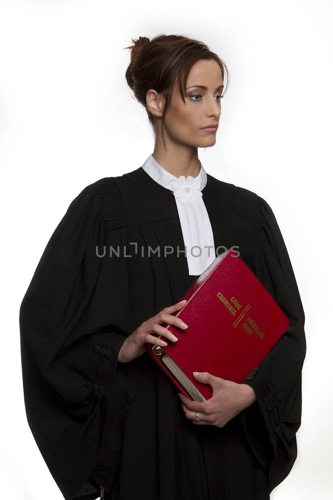 Women dress as a canadian attorney, holding a red book of criminal law with bilingual text on it
