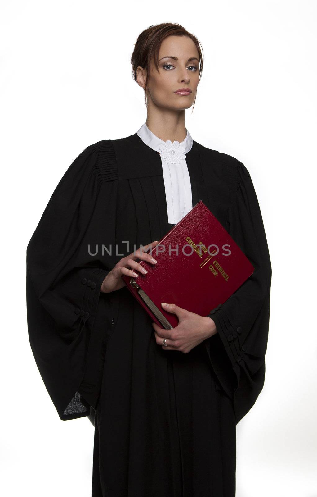 Women dress as a canadian attorney, holding a red book of criminal law with bilingual text on it
