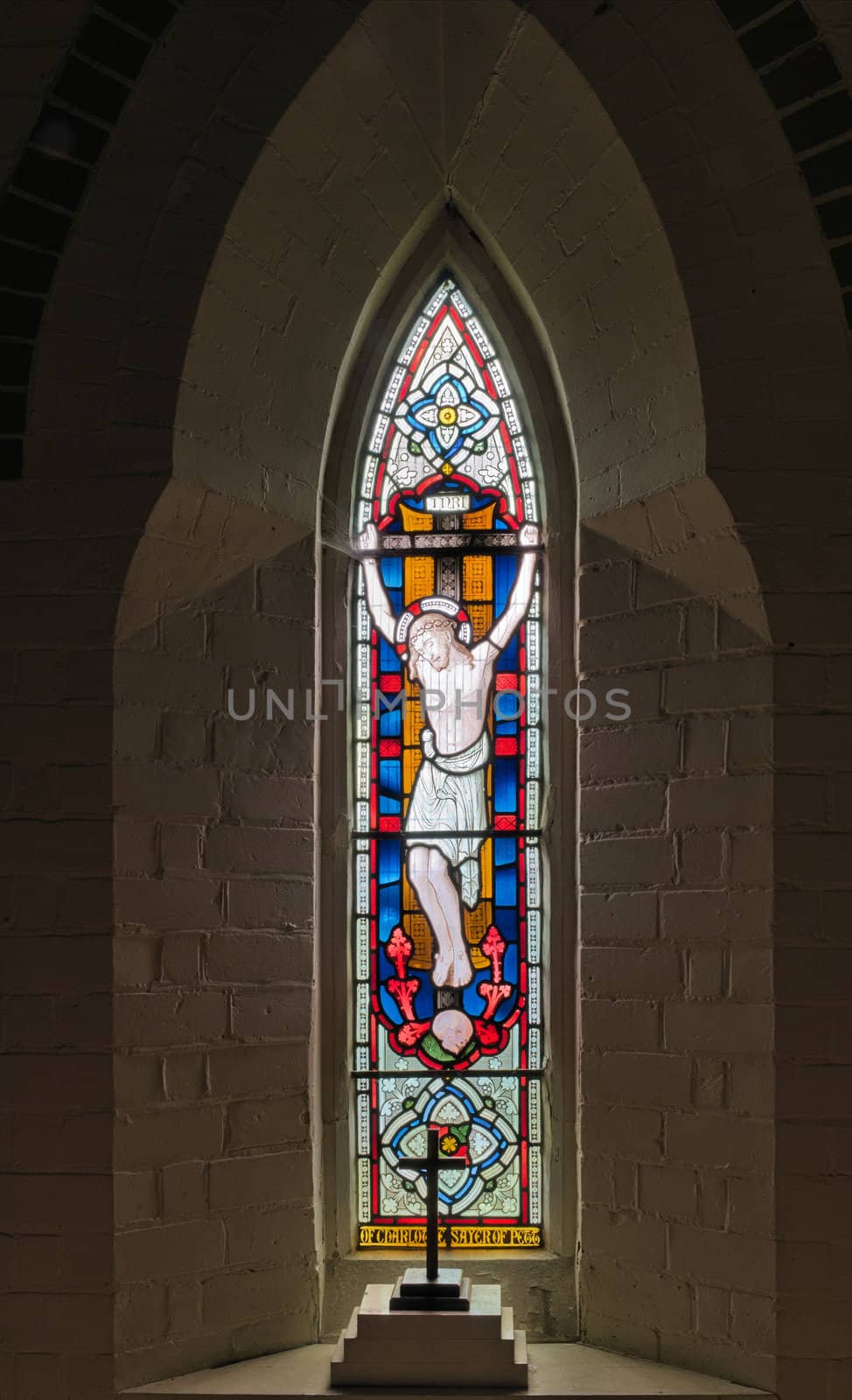 Stained Glass Window depicting Christ on the cross wearing the crown of thorns