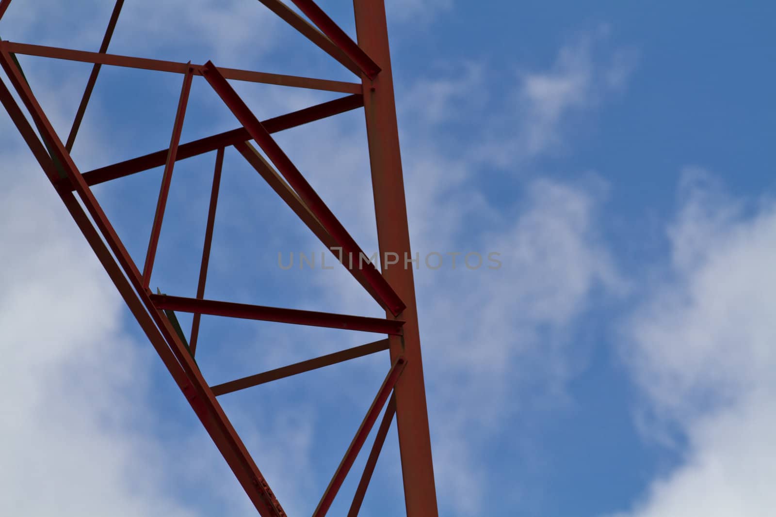 Close up view of the raio tower leg against blue sky