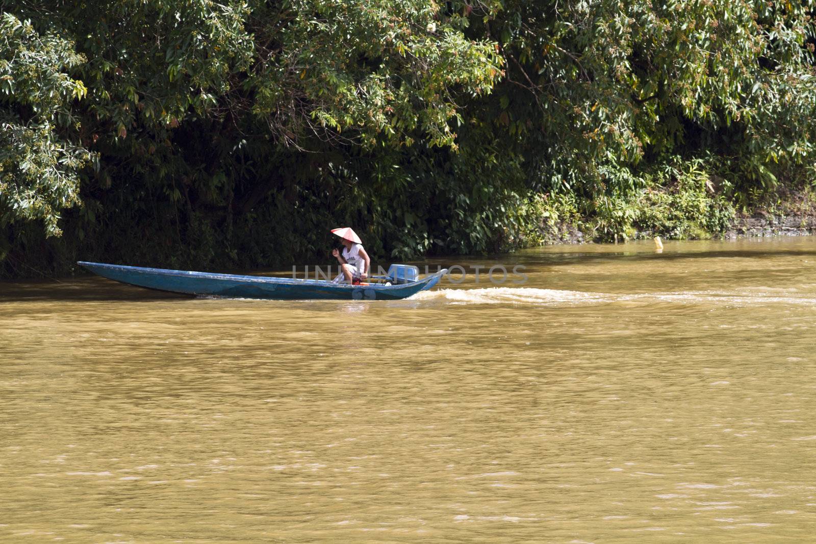 One fisherman using a speed boat on a fishing attempt in Sungei Rajang, Sarawak Malaysia