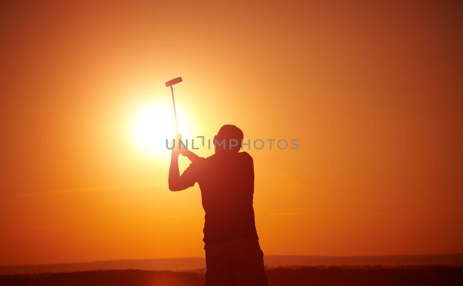 man play golf on sunset,selective focus on head