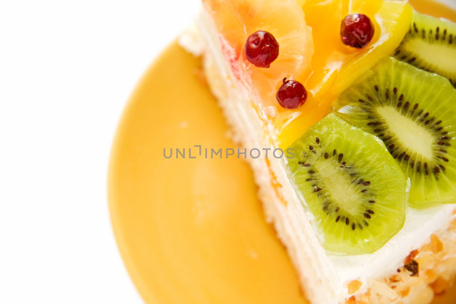 Birthday cake with cream with fruit on the white background