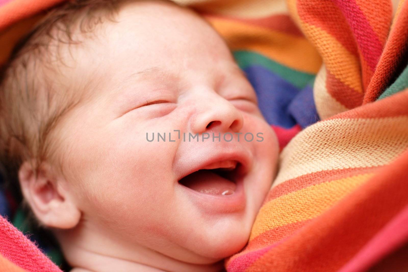 portrait of a close-up, infant lying on the bed