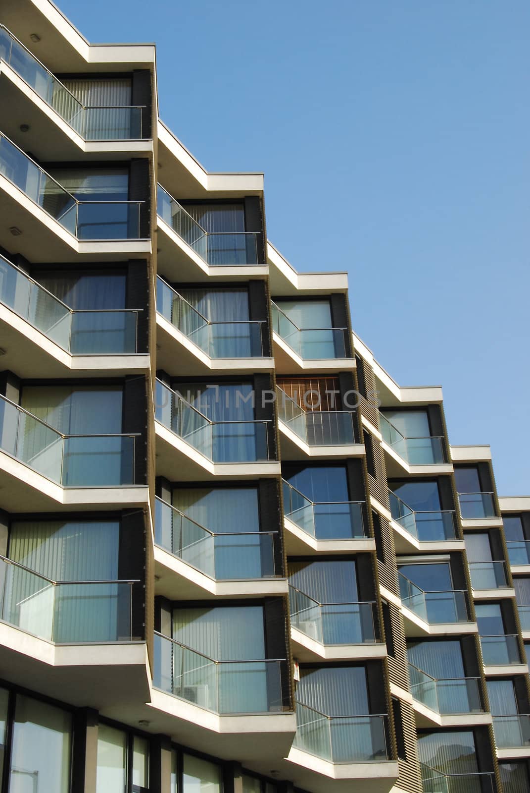 Modern residential building exterior on blue-sky background