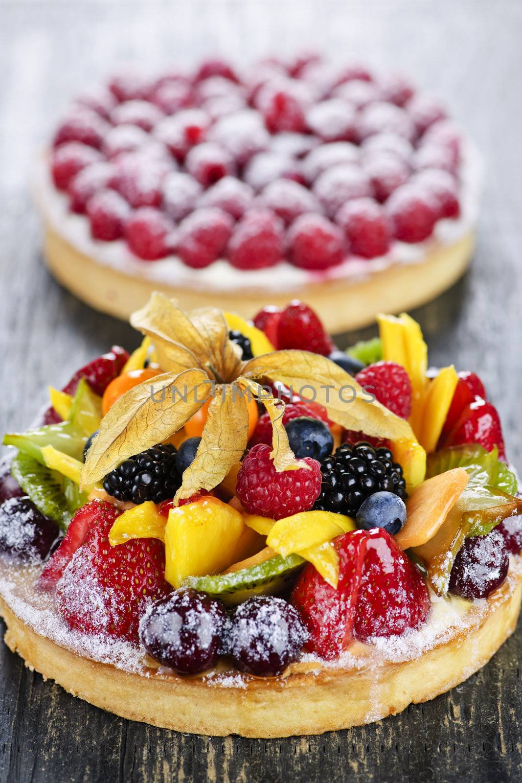 Fresh dessert tarts with assorted fruits and berries