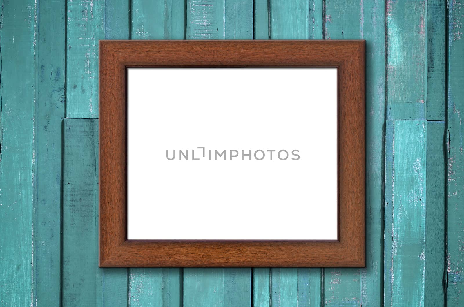 Brown wood picture frame on Green wall by nuttakit