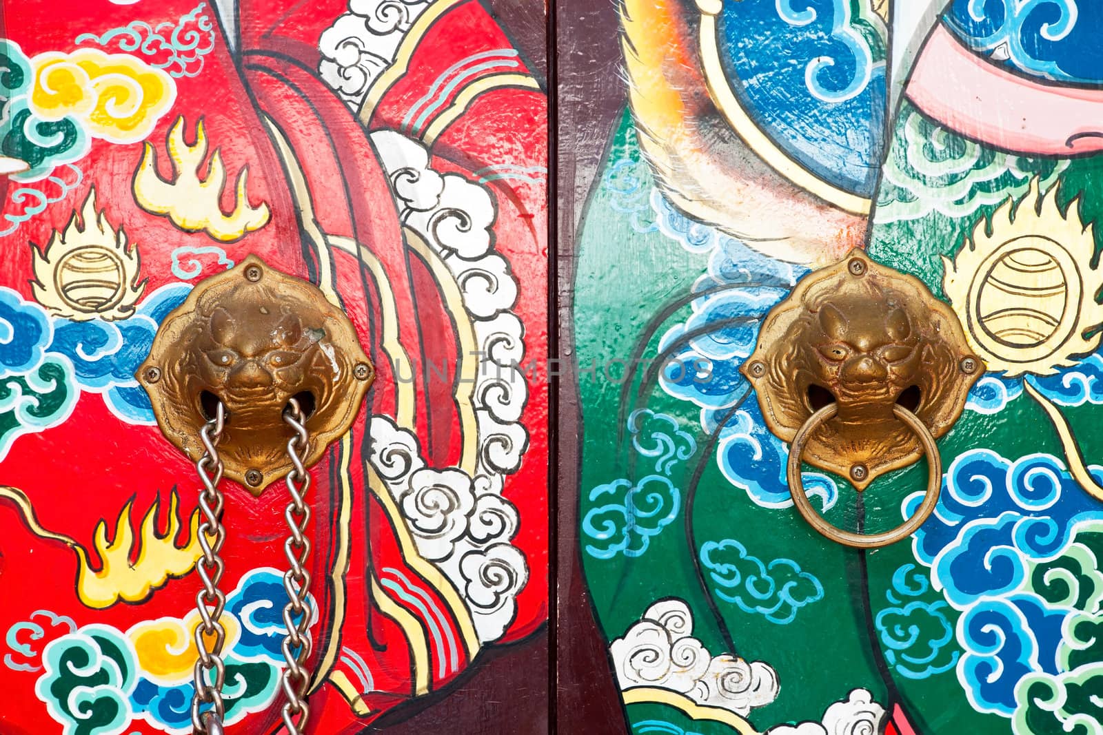 Lion knocker on surface of chinese door by Yuri2012