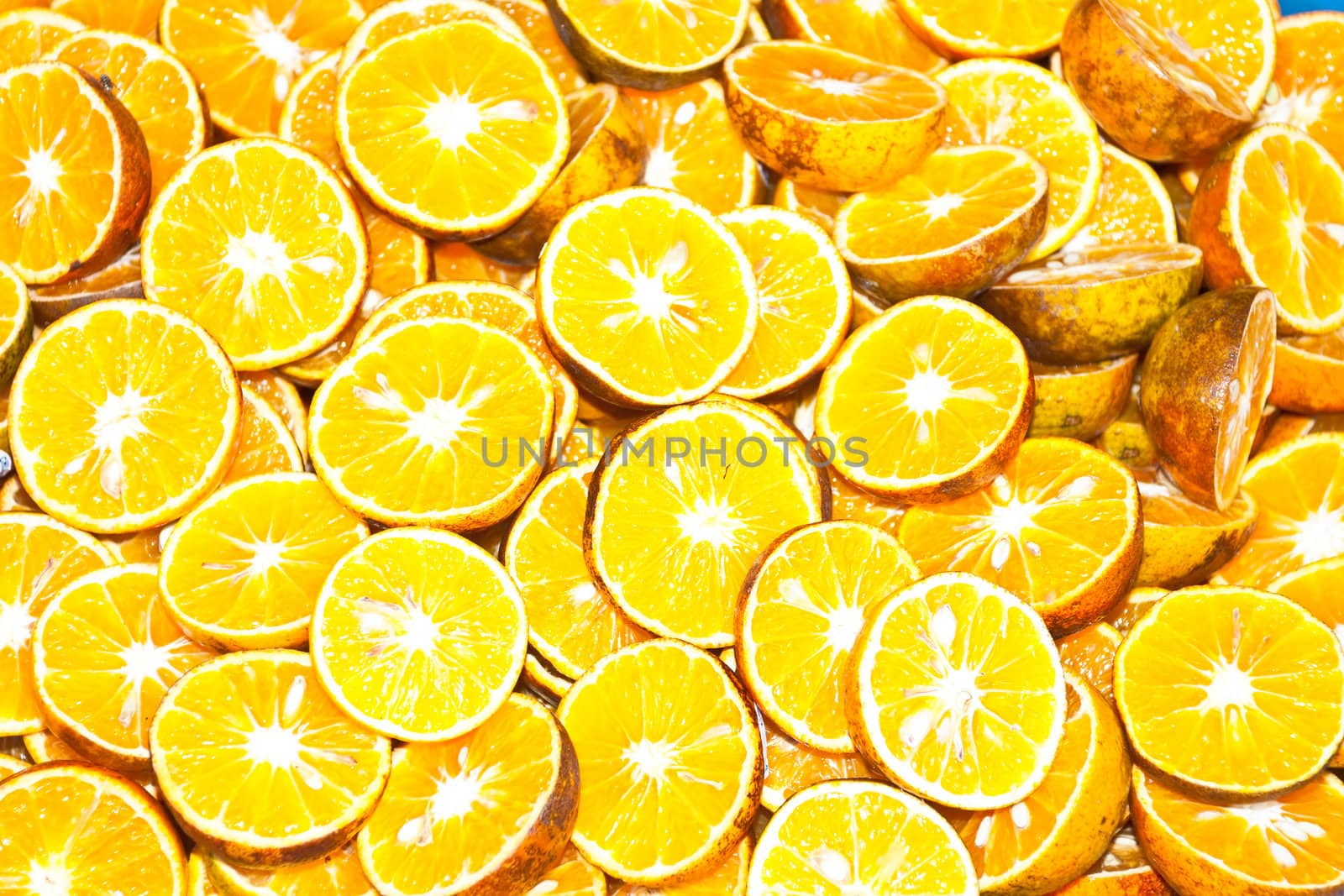 background made of sliced juicy oranges by Yuri2012