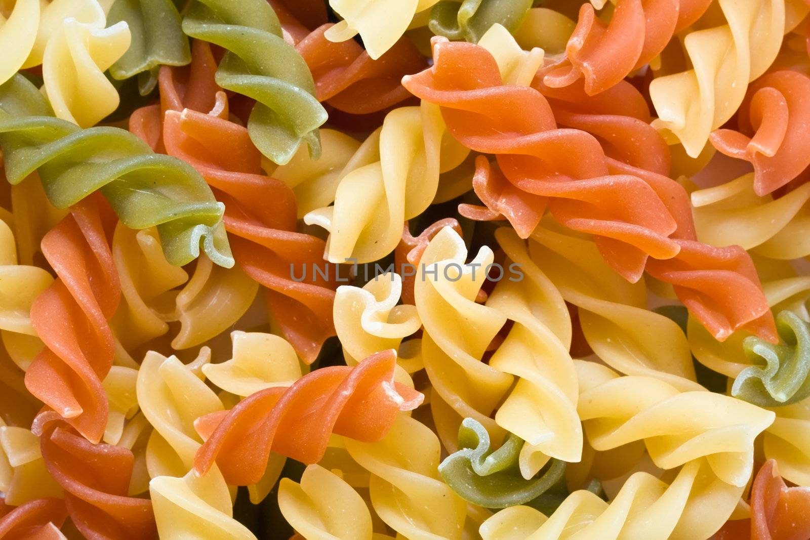 Raw italian pasta isolated on white background