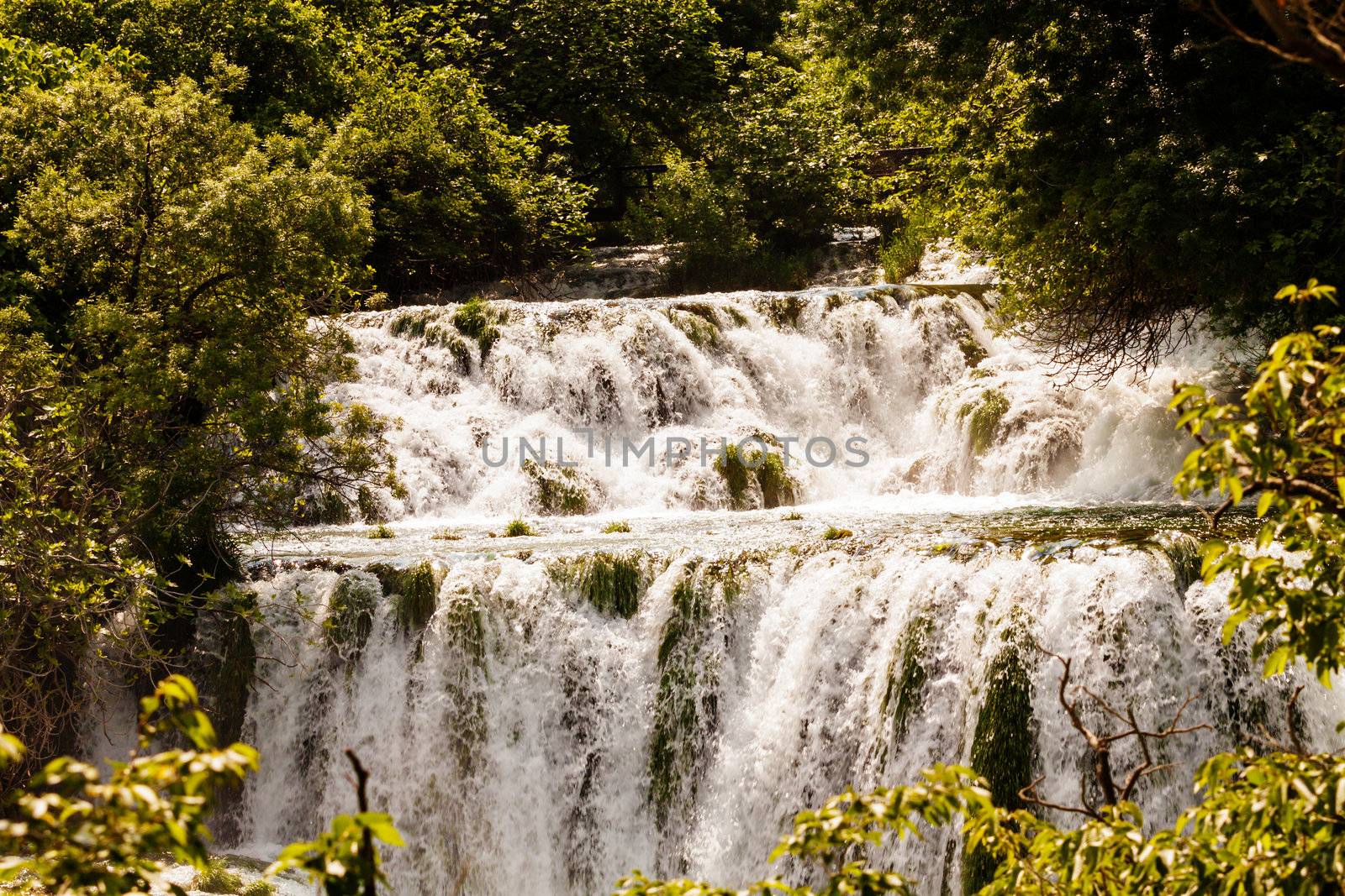Cascade of waterfalls in the forest, Krka national park, Croatia