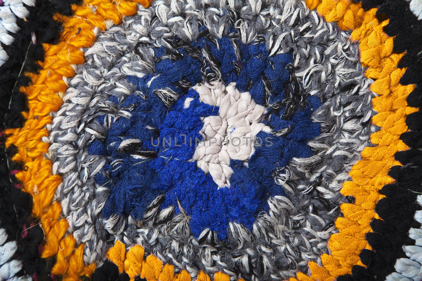 Handmade rug crocheted of colorful fabric ribbons
