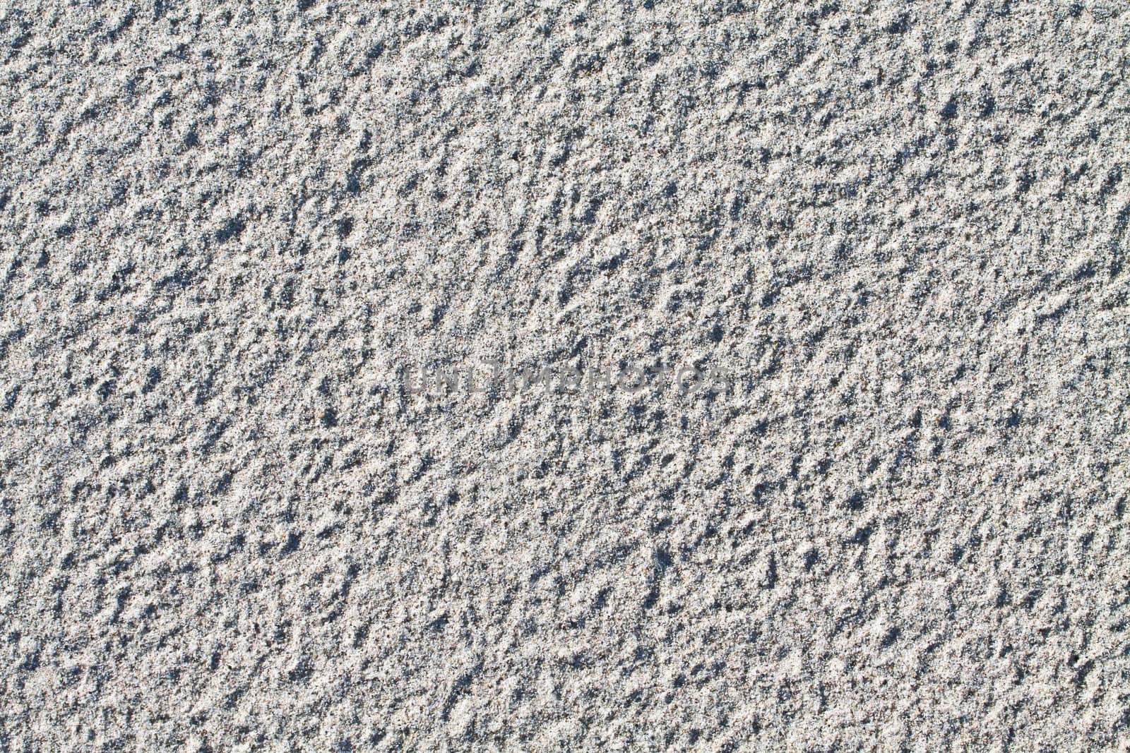 Close up of dry sand ideal for backgrounds and compositions.