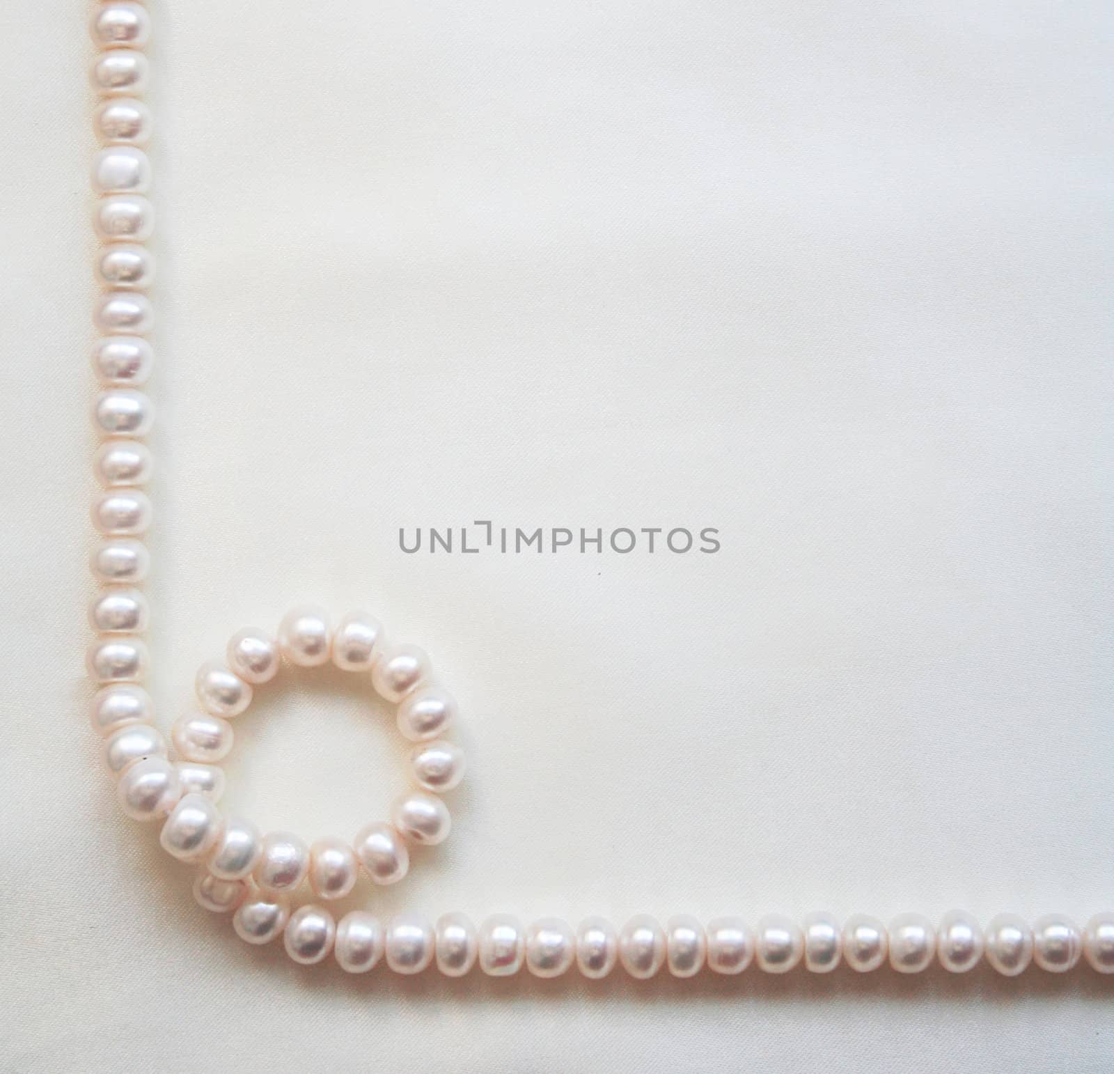 Smooth elegant white silk with pearls can use as wedding background 