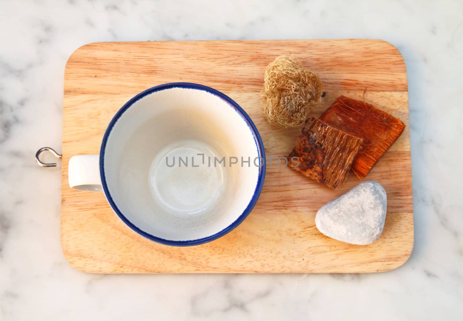 empty cup on chopping board