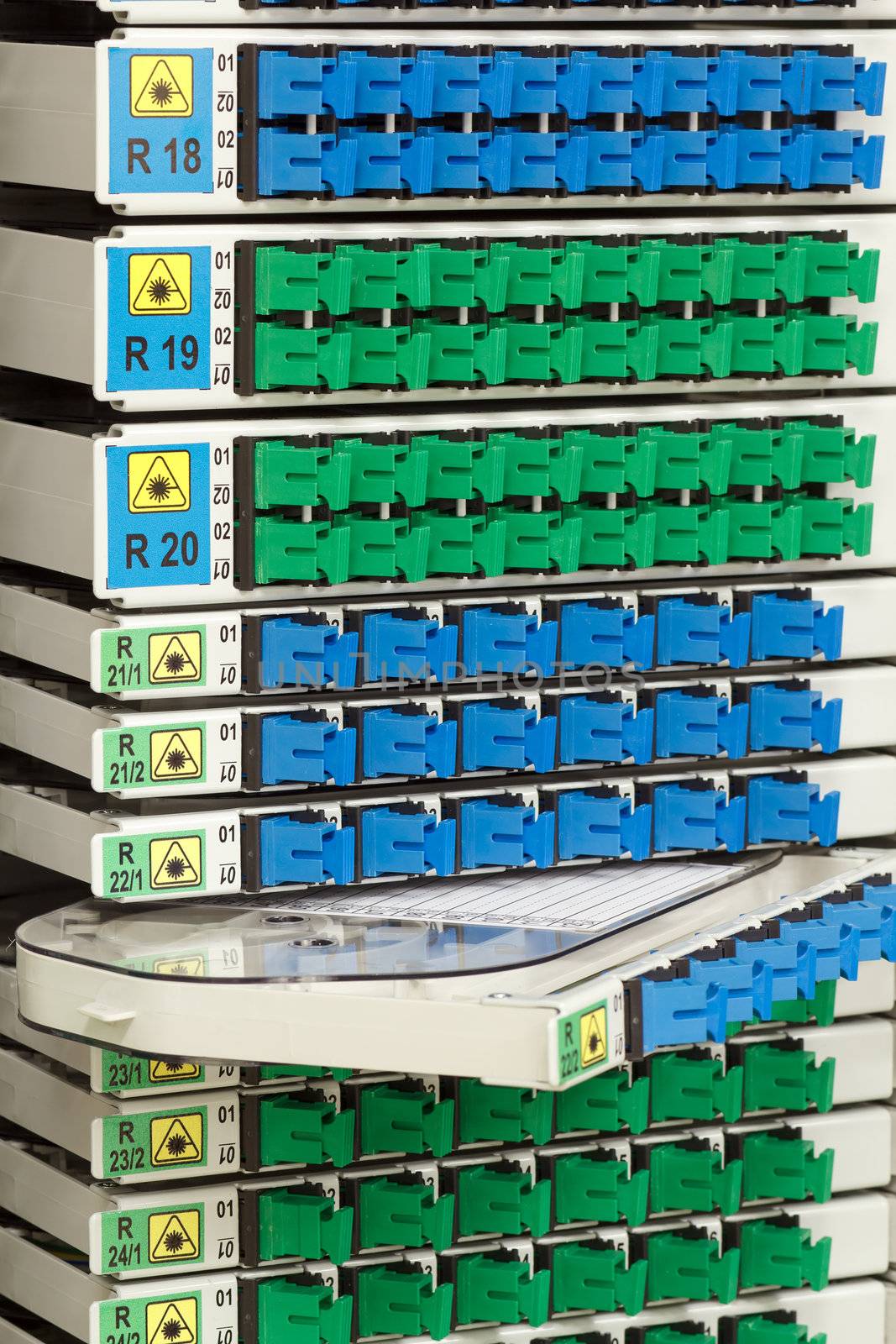 fiber optic cable management system with green and blue SC connectors