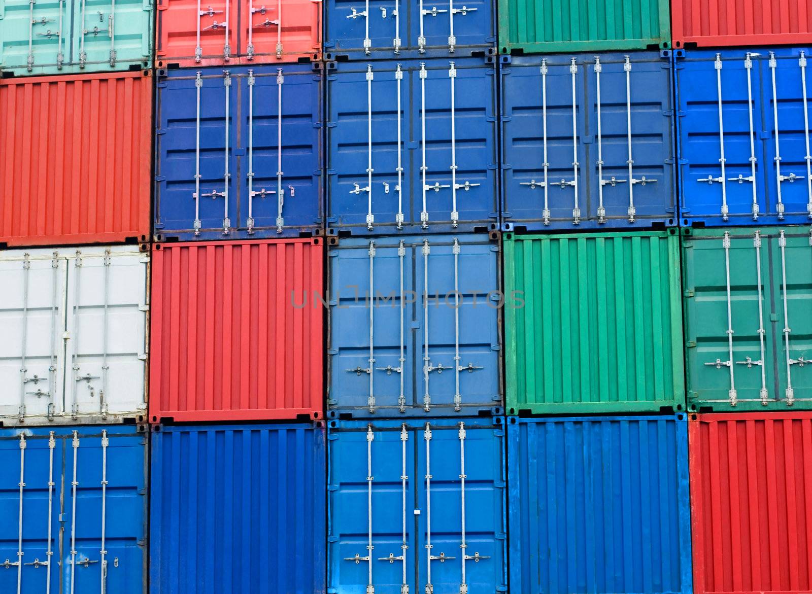 background of multi-colored freight shipping containers at the docks