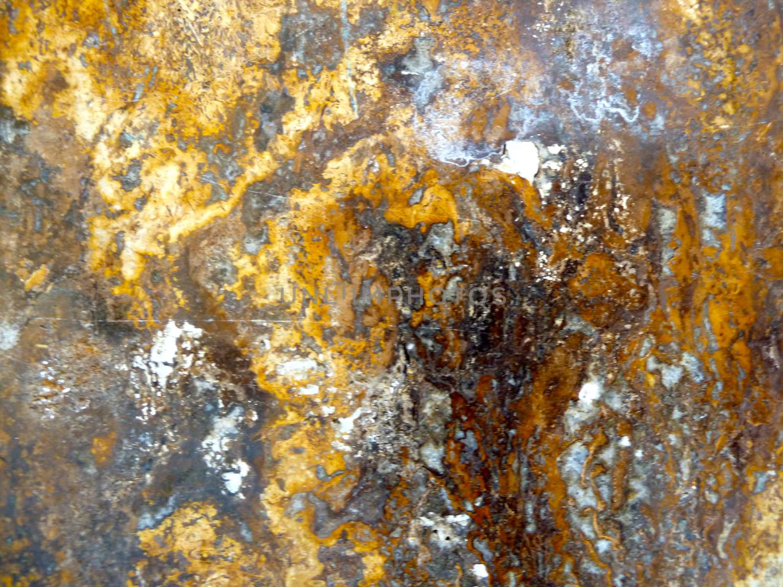 gold coloring on a stone surface
