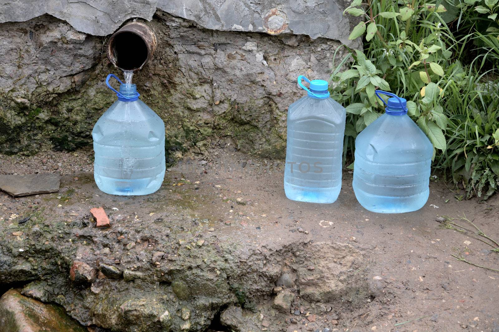 Bottles with water from a spring in the summer